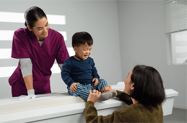 Mom with child as healthcare worker looks on